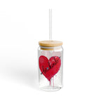 Clear tumbler with a red heart and 'lovelorn' text, wooden lid, and straw on a white background.
