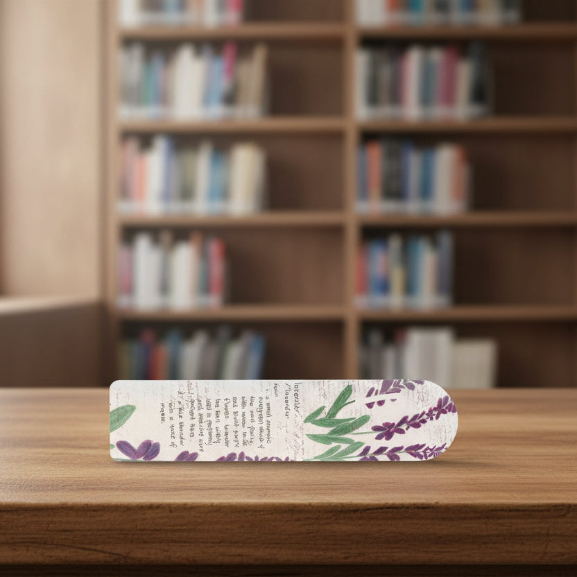 Decorative bookmark with lavender design and text on a library desk
