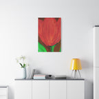 Red tulip painting on a white wall above a white cabinet with decor items.