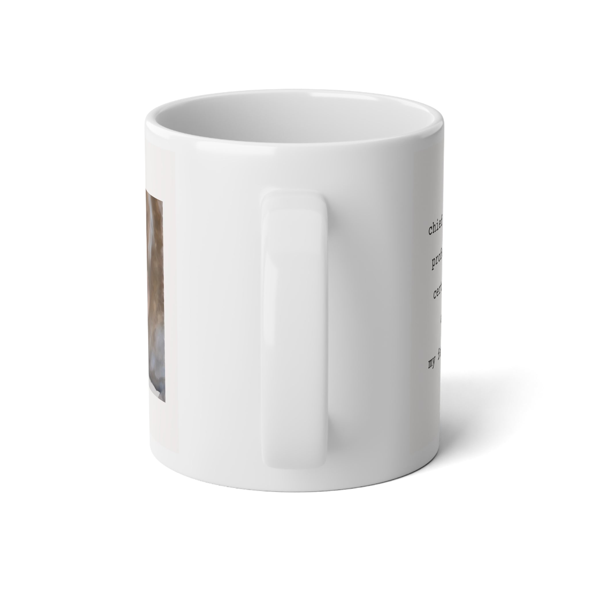 A white ceramic coffee mug with a handle, shown from a side angle on a clean white background. The mug features a partial graphic print on the left side showing a brown and white cat, and some black text is visible on the right side.