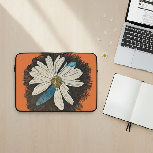 Laptop sleeve with daisy dragonfly wings design on a desk with laptop and notebook next to it.  Original work by Marife Rosales