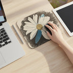 Mousepad featuring a Daisy Dragonfly wings design on a desk with a laptp and an ipad and stylus next to it with a hand on a black mouse.