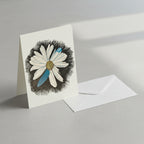 Illustration of a daisy dragonfly wings petal on a greeting card with an envelope leaning on against a wall