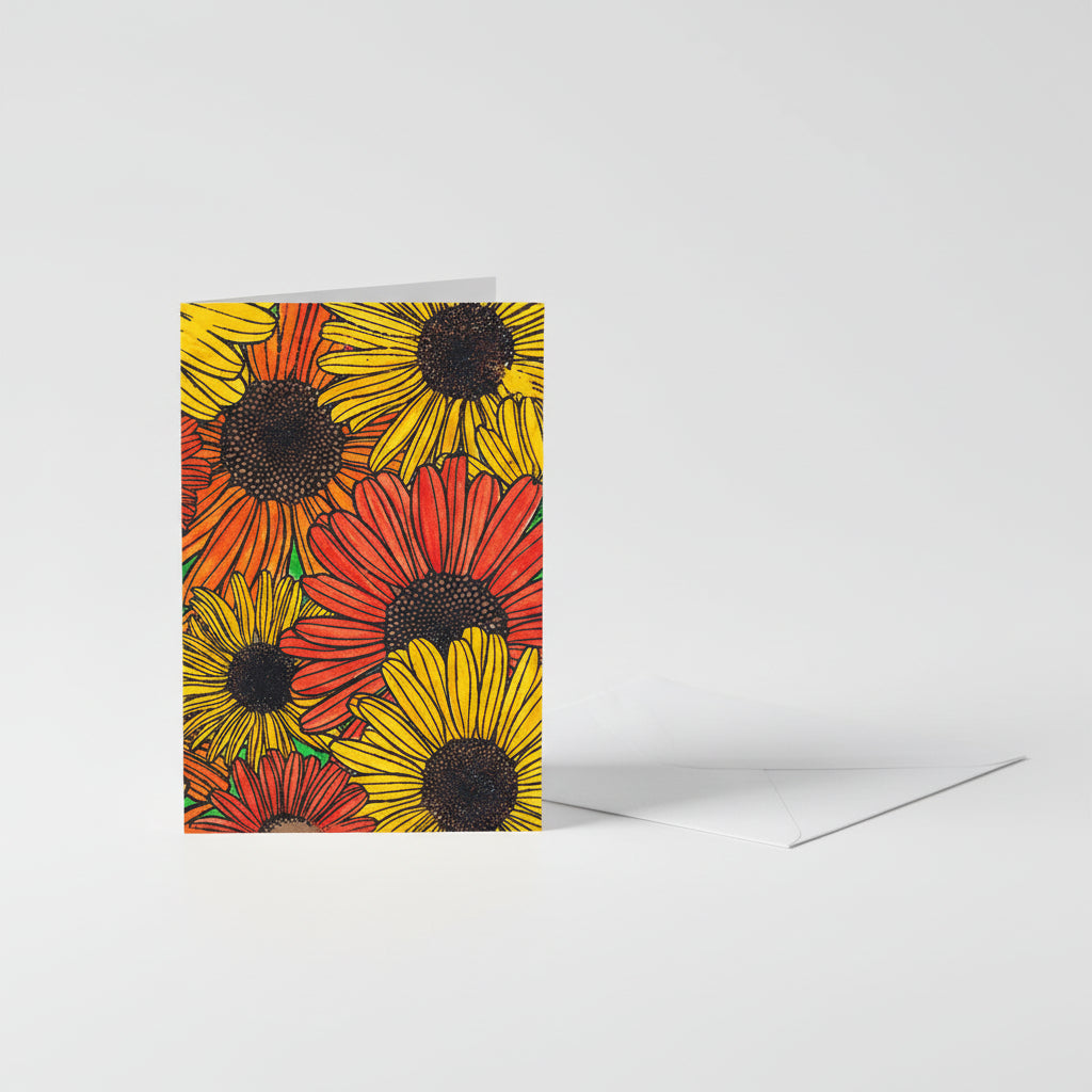 Greeting card with different colored daisies with an envelope