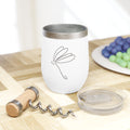 White tumbler with purple text on a wooden table with grapes and a corkscrew.