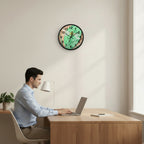Wall clock with a dragonfly design on a green and brown background in a home office setting