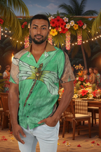 Man wearing a green shirt with a dragonfly design in a tropical setting with decorations and people in the background.