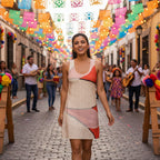 Woman wearing a flower collage with some petals with text on a red background at at fiesta scene
