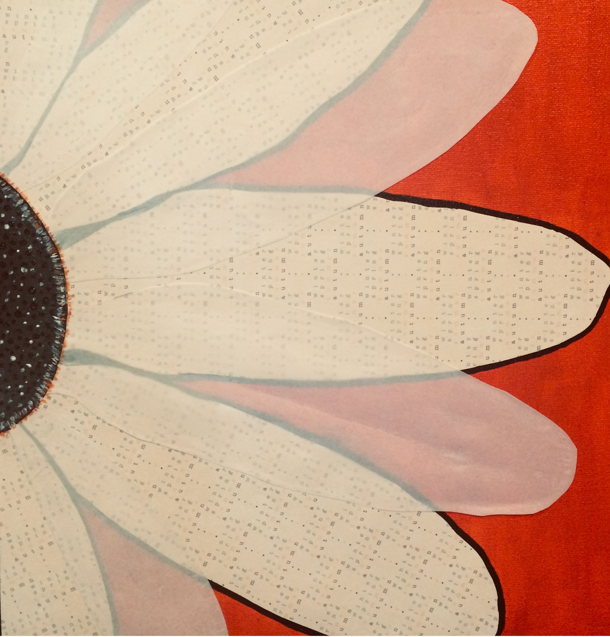 Close-up of a floral design with beige petals and a black center on a red background