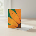 Greeting card with ladybug on sunflower with an envelope by a desk by a window