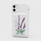 A white rectangular magsafe cardholde or with stitched edges, featuring a printed lavender illustration and handwritten-style text on a textured off-white background, attached to a mobile phone on a white background