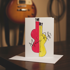 A stylized illustration of two guitar-like musical instruments split vertically, one in bright pink and one in yellow, with the words 'Music Rift' written across them in black script on an off-white background in a music room with a blurred electric guitar in the back.