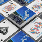 Playing cards with scenic design on a gray surface