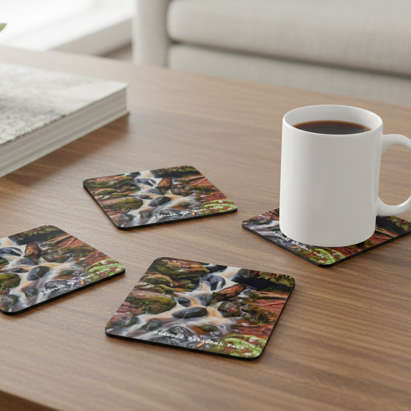 Set of four coasters of Redwood National Park waterfalls with a mug of coffee on coffee table