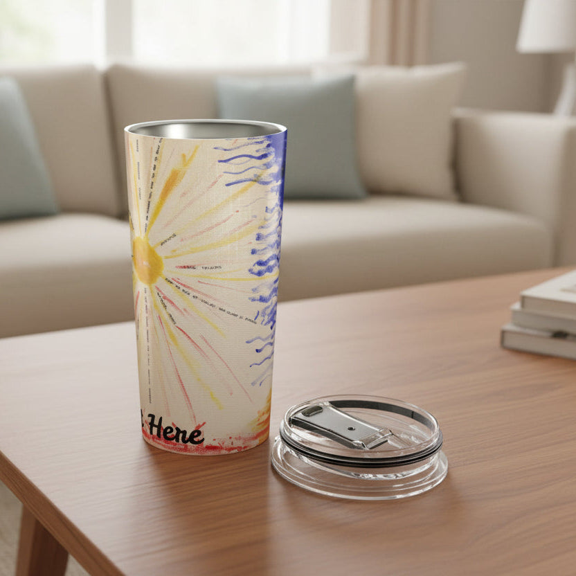 Tumbler with a yellow sun and blue lines with partial text showing Here