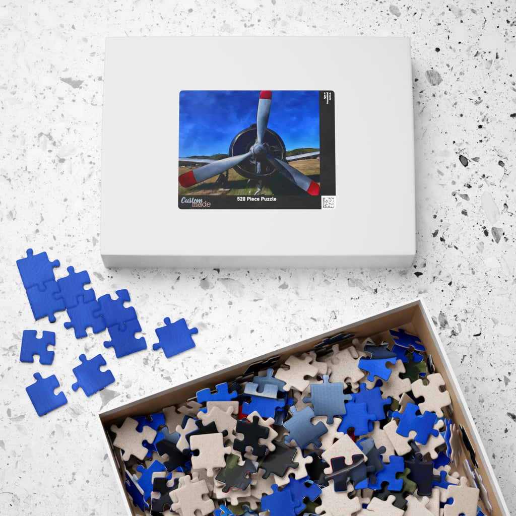 Jigsaw puzzle set with pieces and packaging on a textured surface