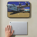 Laptop sleeve with a design of a vintage flying boat airplane with a ipad and hand below it designed by Marife Rosales of MyLittleFe.