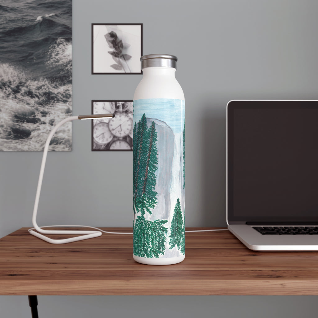 Water bottle with Yosemite Falls Design on a desk next to a laptop.  Designed by Marife Rosales