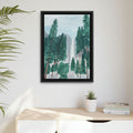 Framed artwork of a trees at Yosemite with waterfall scene on a wall above a desk with a plant and books.