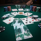 A deck of cards at a card room with poker chips with design of Yosemite pine trees