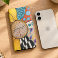 Flip phone with Art design Zentangle and sunflower next to a white iphone
