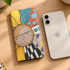 Flip phone with Art design Zentangle and sunflower next to a white iphone