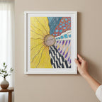 Zentangle Sunfloer Journey Jigsaw Puzzle framed hung on a wall with a hand holding it