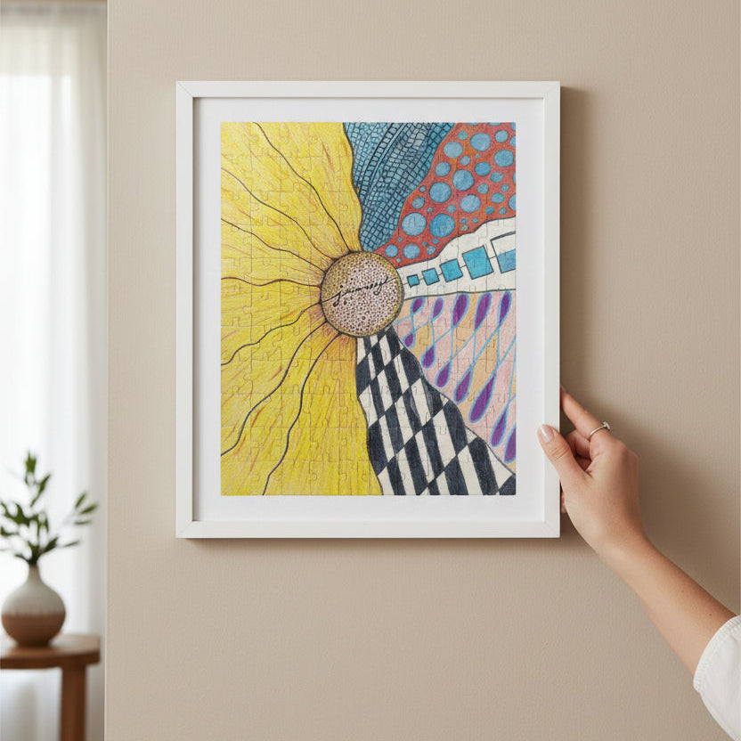 Zentangle Sunfloer Journey Jigsaw Puzzle framed hung on a wall with a hand holding it