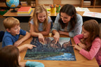 Teacher and students looking at a completed jigsaw puzzle with Zion National Park photographed by Bay Area Artist Marife Rosales of MyLittleFe