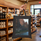 Zion National Park Tote bag in a gift store held by a hand 