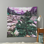 Tapestry with a mountain landscape design hanging on a wall.
