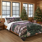 Bedroom with a bed featuring a nature-themed comforter, Christmas trees, and snowy window view.
