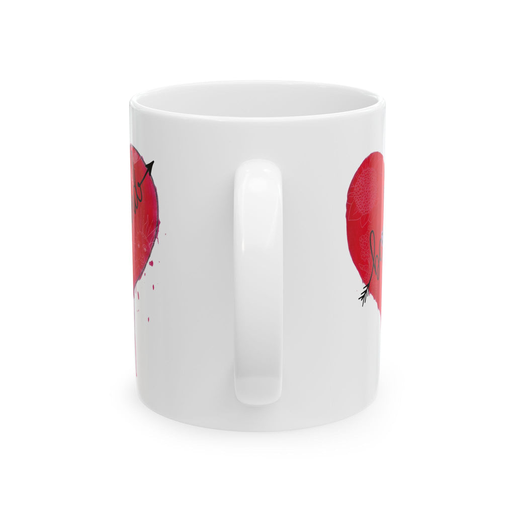 White mug with red heart designs on a white background